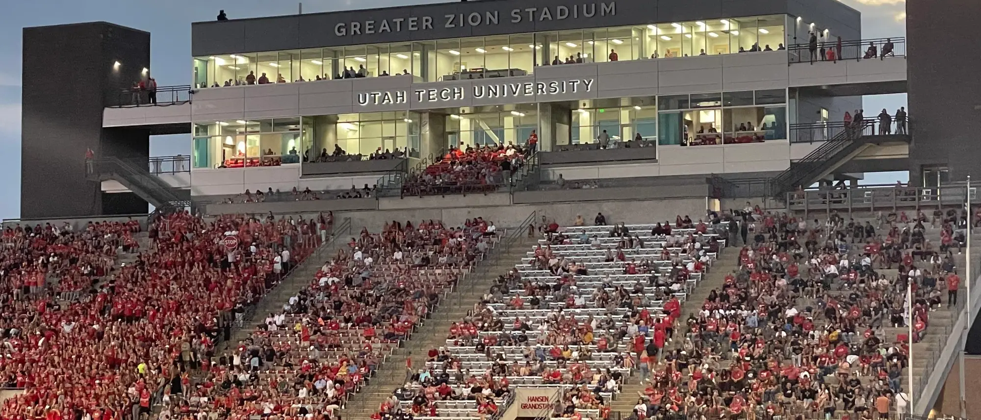 Greater Zion Stadium in St. George, bleachers rising on both sides of a green field.
